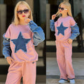 Mädchen trägt 2-teiliges Set in Rosa mit Denim-Stern-Patch und Jeans-Ärmeln