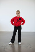 Mädchen-Set mit 3D-Blumenapplikation – roter Oversized-Sweater mit schwarzer Rose und schwarze Schlaghose